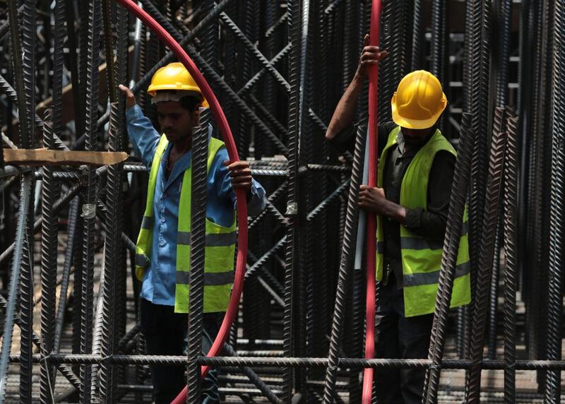 The kingdom’s Saudisation efforts resulted in losses of foreign jobs, most of which were in construction and manufacturing, where companies struggle to meet Saudisation quotas. Hasan Jamali / AP Photo
