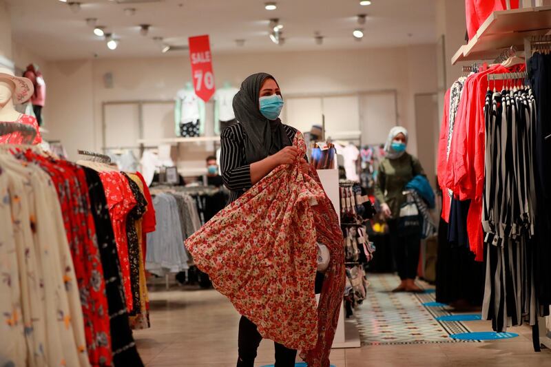 People shop at the re-opened Babylon Mall in Baghdad, Iraq. AP Photo