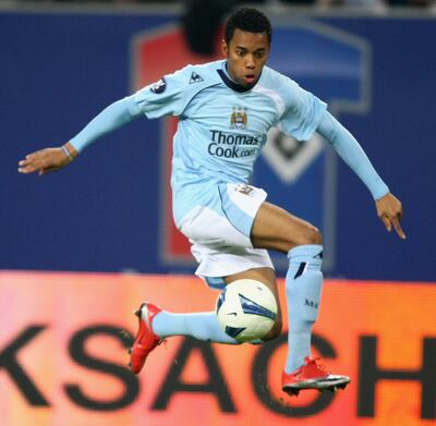 HAMBURG, GERMANY - APRIL 09:  Robinho of Manchester runs with the ball during the UEFA Cup quarter final first leg match between HSV Hamburg and Manchester City at the HSH Nordbank Arena on April 9, 2009 in Hamburg, Germany.  (Photo by Martin Rose/Bongarts/Getty Images)