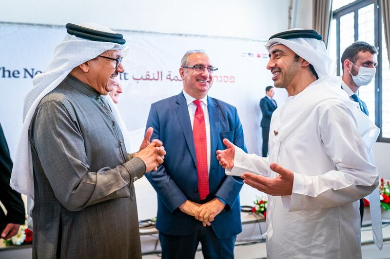 Bahrain's Foreign Minister Abdullatif bin Rashid al-Zayani (L) speaking with Emirati Minister of Foreign Affairs and International Cooperation Abdullah bin Zayed Al Nahyan (R) during the Negev summit in the Israeli kibbutz of Sde Boker. WAM