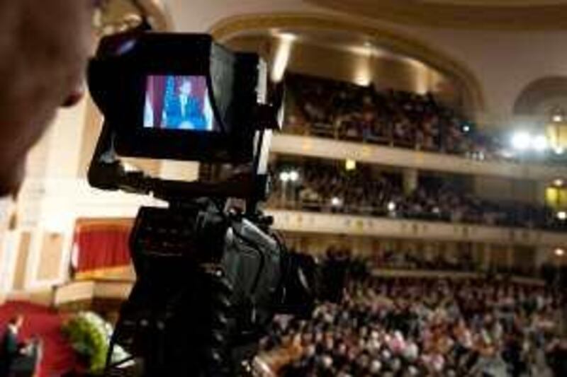 A cameraman films as US President Barack Obama delivers his highly-anticipated address to the Muslim world on June 4, 2009 in the Grand Hall of Cairo University in Cairo. Obama said that he wants "a new beginning" with the world's 1.5 billion Muslims, and called for an end to a cycle of "suspicion and discord."<br />AFP PHOTO/SAUL LOEB *** Local Caption ***  102866-01-08.jpg *** Local Caption ***  102866-01-08.jpg