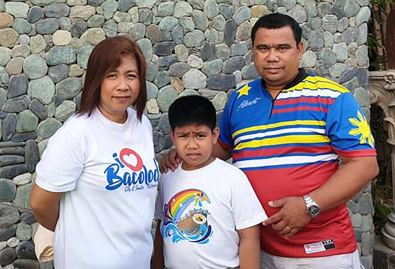 Albert Sabado with wife Mary Joy and their son, Alvin. Picture supplied by family    