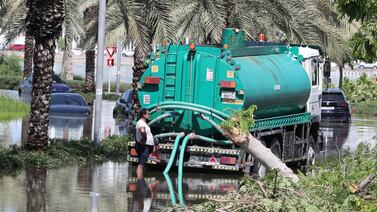 Tankers clear waterlogged roads in Dubai's Al Furjan area after the April floods. The drainage system aims to divert stormwater. Pawan Singh / The National