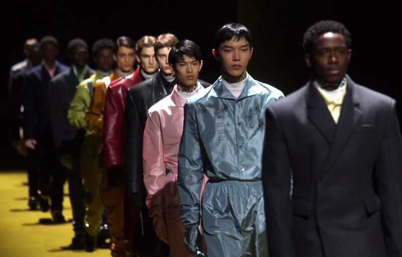 Models present creations by Prada during the Milan men's fashion week. EPA