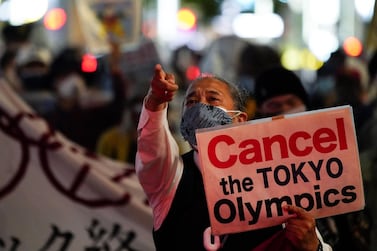 A member holds a sign during a protest march by an anti-Olympics group in Tokyo on Monday, May 17. Reuters