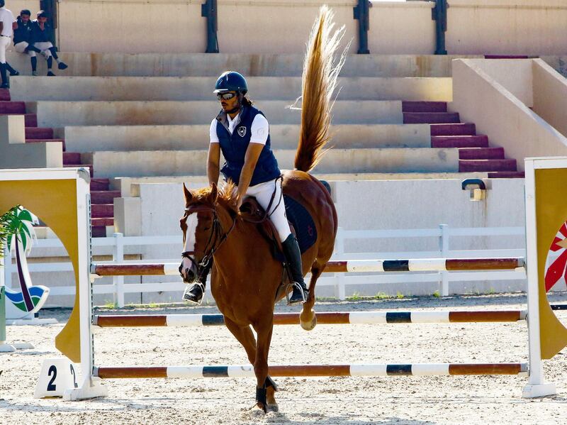 Kuwaiti rider Yaqoub al-Nasserallah takes part on his horse "Heidi", in a horse jumping competition in Kuwait City. AFP