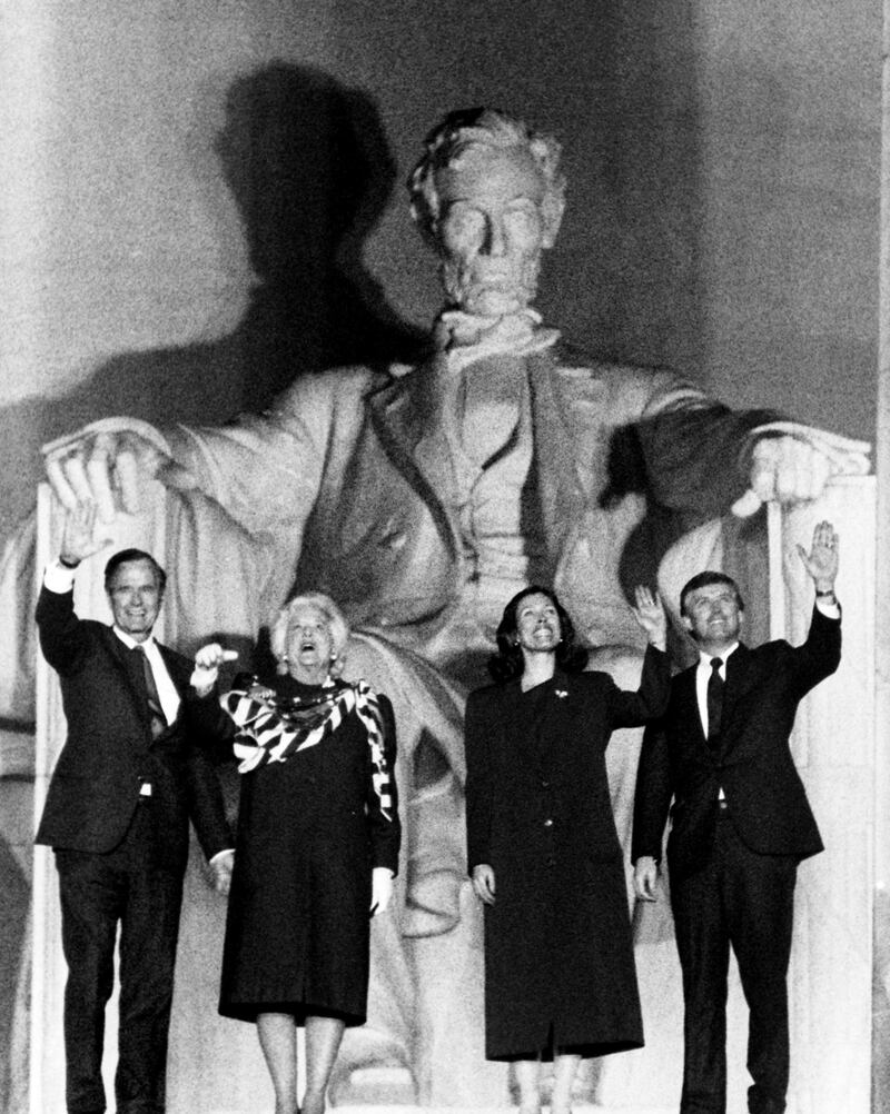 US President-elect George Bush (L),is joined by (from left) his wife Barbara, Marilyn Quayle, and Vice President-elect Dan Quayle on the top step of the Lincoln Memorial in Washington during the opening ceremony for his inauguration as president on January 18, 1989. (Photo by Jerome DELAY / AFP)