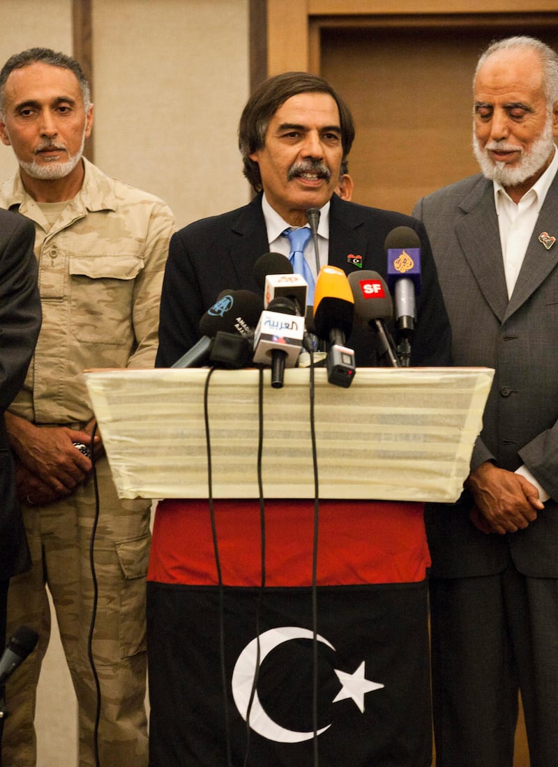 Ali Tarhouni, finance minister in the rebels' National Transitional Council,   speaks during a news conference in Tripoli, LIbya, Thursday, Aug. 25, 2011.  Ali Tarhouni, a member of Libya's rebel Cabinet says it is moving immediately to Tripoli from its eastern stronghold city of Benghazi, as opponents of Moammar Gadhafi solidify their control over the capital they overran four days ago.  (AP Photo/Giulio Petrocco) *** Local Caption ***  Mideast Libya.JPEG-06152.jpg