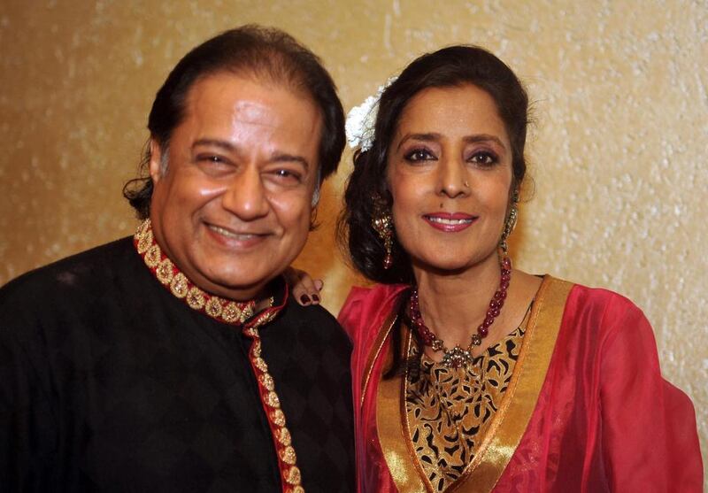 Indian bhajan samrat and ghazal singer Anup Jalota (L) poses for a photograph alongside his wife Medha during celebrations for his 61st birthday in Mumbai on late July 29, 2014. AFP PHOTO/STR