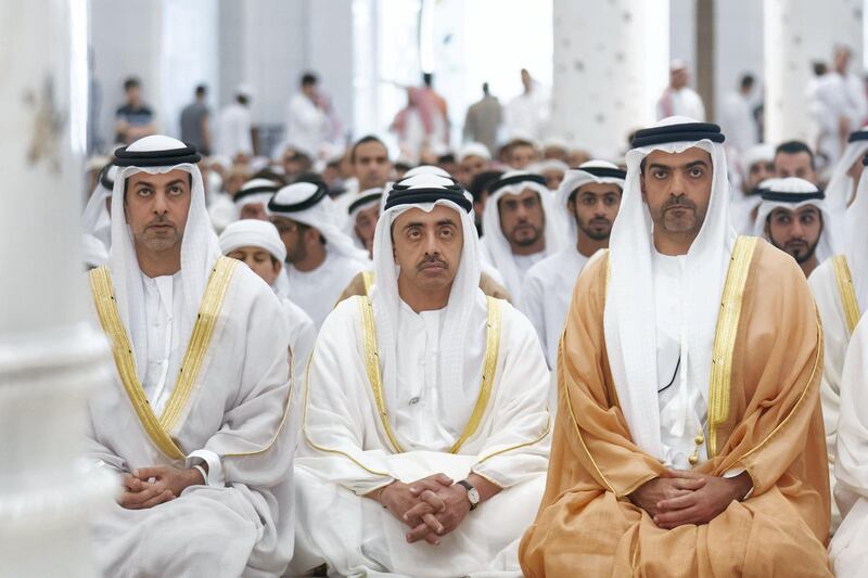 ABU DHABI, UNITED ARAB EMIRATES -June 15, 2018: HH Sheikh Omar bin Zayed Al Nahyan, Deputy Chairman of the Board of Trustees of Zayed bin Sultan Al Nahyan Charitable and Humanitarian Foundation (L), HH Sheikh Abdullah bin Zayed Al Nahyan, UAE Minister of Foreign Affairs and International Cooperation (C) and HH Sheikh Hamed bin Zayed Al Nahyan, Chairman of the Crown Prince Court of Abu Dhabi and Abu Dhabi Executive Council Member (R), attend Eid Al Fitr prayers at Sheikh Zayed Grand Mosque.

( Eissa Al Hammadi for Crown Prince Court - Abu Dhabi )
---