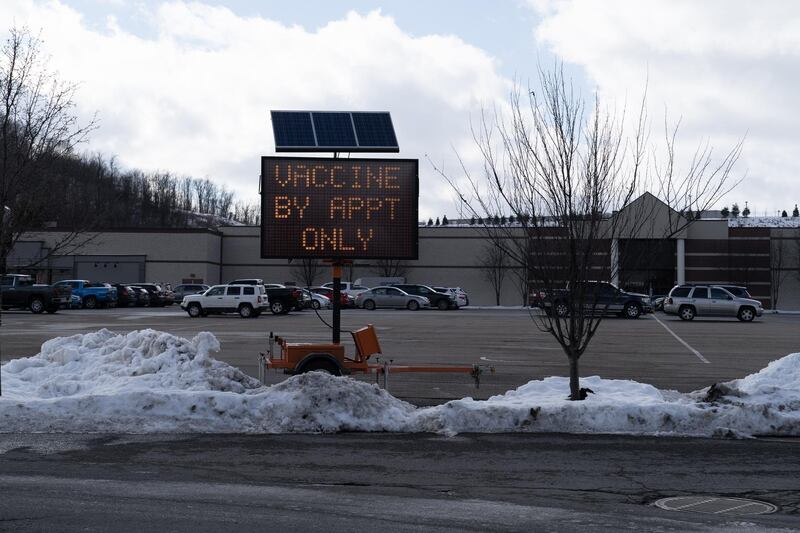 A sign saying "Vaccines by appointments only" outside a strip mall near Morgantown, West Virginia. Willy Lowry / The National