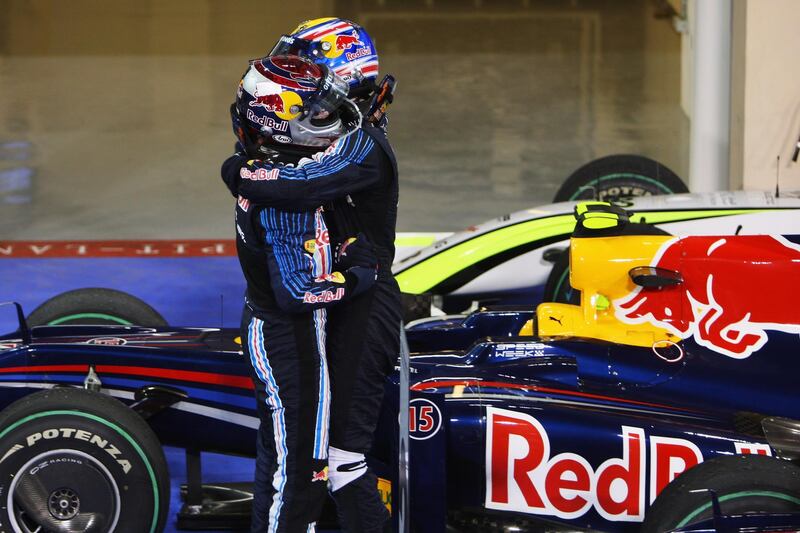 ABU DHABI, UNITED ARAB EMIRATES - NOVEMBER 01:  Sebastian Vettel (L) of Germany and Red Bull Racing celebrates with second placed team mate Mark Webber  (R)of Australia and Red Bull Racing in parc ferme after winning the Abu Dhabi Formula One Grand Prix at the Yas Marina Circuit on November 1, 2009 in Abu Dhabi, United Arab Emirates.  (Photo by Mark Thompson/Getty Images)