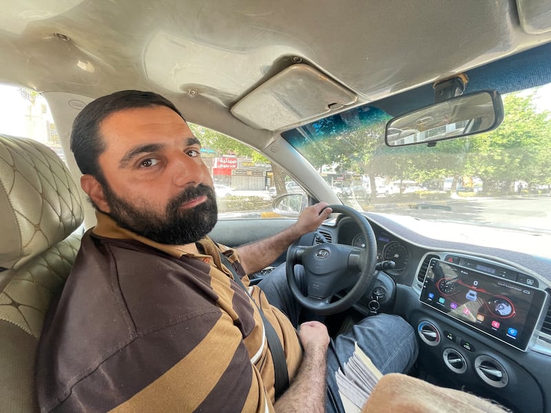 Baghdad-based taxi driver Wissam Mohammed Abbas, 35, finds himself at the epicentre of a prolonged economic dilemma. Sinan Mahmoud / The National