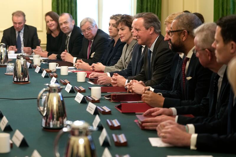 Britain's new Foreign Secretary David Cameron, fourth right, attends his first Cabinet meeting at No 10 Downing Street. AP