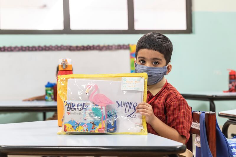 A pupil shows off his creativity on the first day of school.