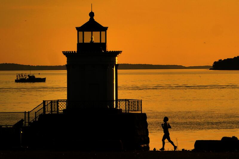 A jogger runs in South Portland, in the US state of Maine. AP