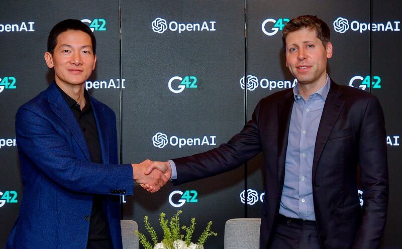 Peng Xiao, group chief executive of G42, and Sam Altman, co-founder and chief executive of OpenAI, during a signing ceremony for the partnership. Photo: G42