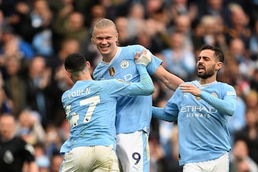 MANCHESTER, ENGLAND - MAY 04: Erling Haaland of Manchester City celebrates scoring his team's fourth goal with teammates Phil Foden and Bernardo Silva during the Premier League match between Manchester City and Wolverhampton Wanderers at Etihad Stadium on May 04, 2024 in Manchester, England. (Photo by Michael Regan / Getty Images)