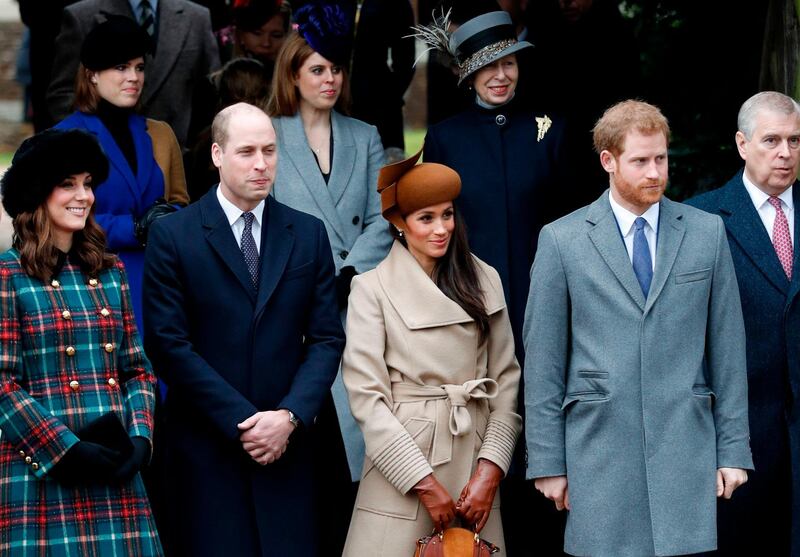 Britain's Catherine, Duchess of Cambridge, (L) and Britain's Prince William, Duke of Cambridge, (2L), US actress and fiancee of Britain's Prince Harry Meghan Markle (2R) and Britain's Prince Harry (R) stand together as they wait to see off Britain's Queen Elizabeth II after attending the Royal Family's traditional Christmas Day church service at St Mary Magdalene Church in Sandringham, Norfolk, eastern England, on December 25, 2017. / AFP PHOTO / Adrian DENNIS
