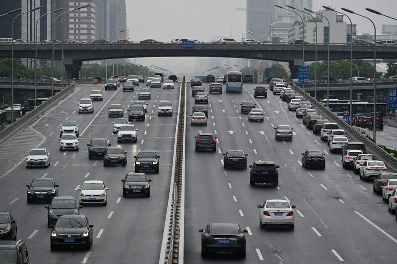 A general view shows cars on a street in Beijing on May 8, 2020. / AFP / WANG Zhao
