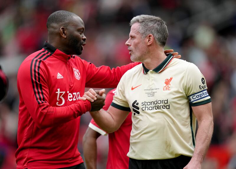 Manchester United's Louis Saha (left) and Jamie Carragher. PA