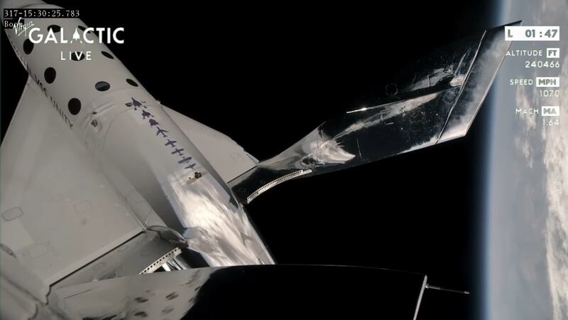 The VSS Unity spaceplane climbs to the boundary of space.