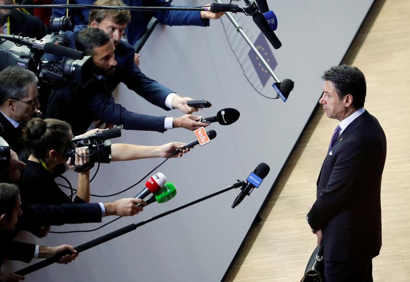 Italian Prime Minister Giuseppe Conte speaks to the media as he arrives for the European Union leaders summit in Brussels, Belgium. Reuters