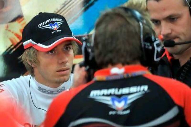 Charles Pic, left, has risen quickly through the ranks but his future with the Marussia team is still uncertain. Jung Yeon-Je / AFP