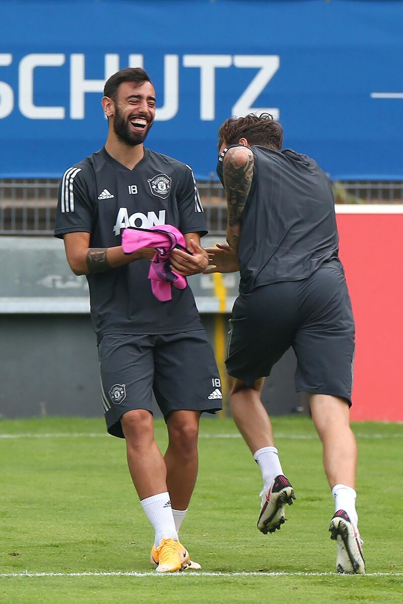 COLOGNE, GERMANY - AUGUST 15:  Bruno Fernandes of Manchester United laughs during a training session at RheinEnergieStadion on August 15, 2020 in Cologne, Germany. (Photo by Matthew Peters/Manchester United via Getty Images)