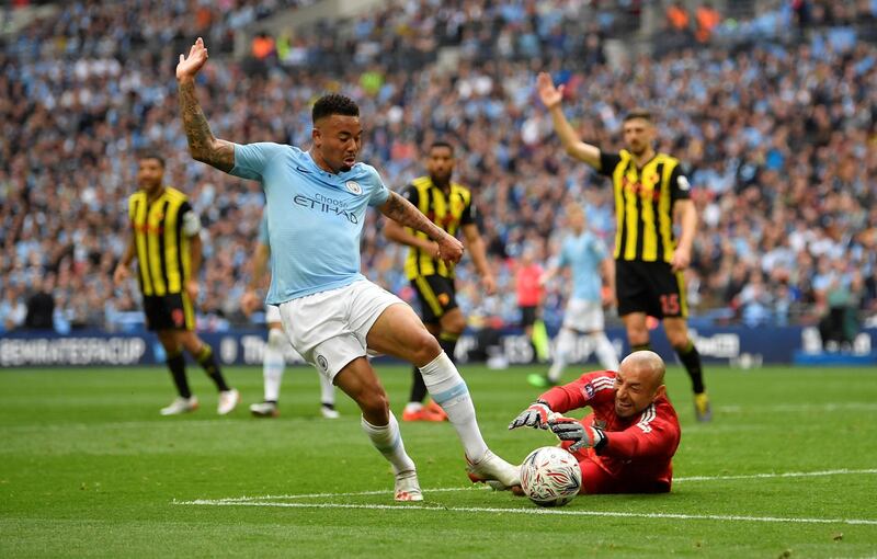 Manchester City's Gabriel Jesus in action with Watford's Heurelho Gomes. Reuters