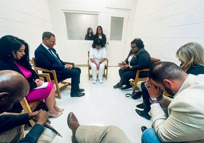 Melissa Lucio bows her head in prayer during a meeting with a bipartisan group of Texas politicians at Gatesville Correctional Facility, Texas. AFP