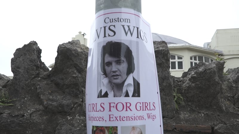 Posters for Elvis wigs are pinned to lampposts in Porthcawl.