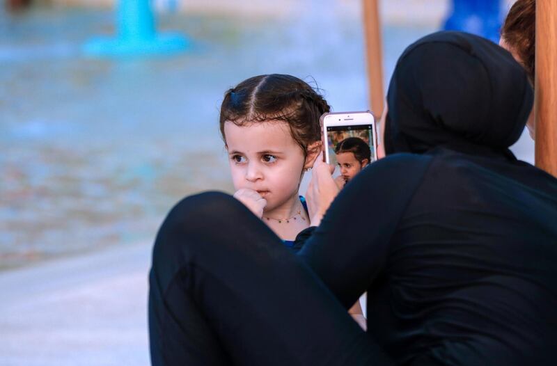 Abu Dhabi, United Arab Emirates, August 4, 2020.   Yas Waterworld Abu Dhabi opens with 30% capacity as Covid-19 restrictions slowly come to an ease.  Yasmina Houda -3 gets her photo taken by her aunt at one of the kiddie pools at the waterpark.
Victor Besa /The National
Section: NA
Reporter:
