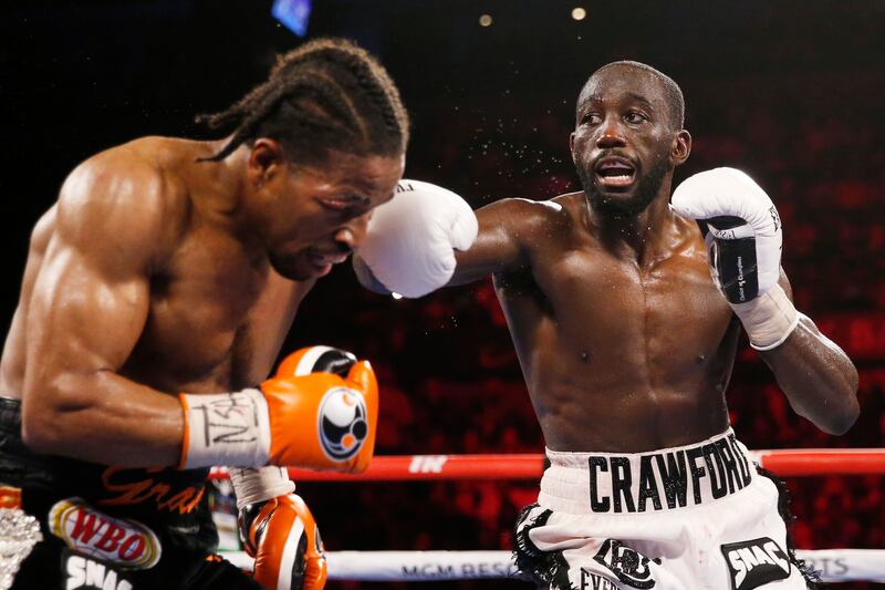 Terence Crawford hits Shawn Porter. AP Photo