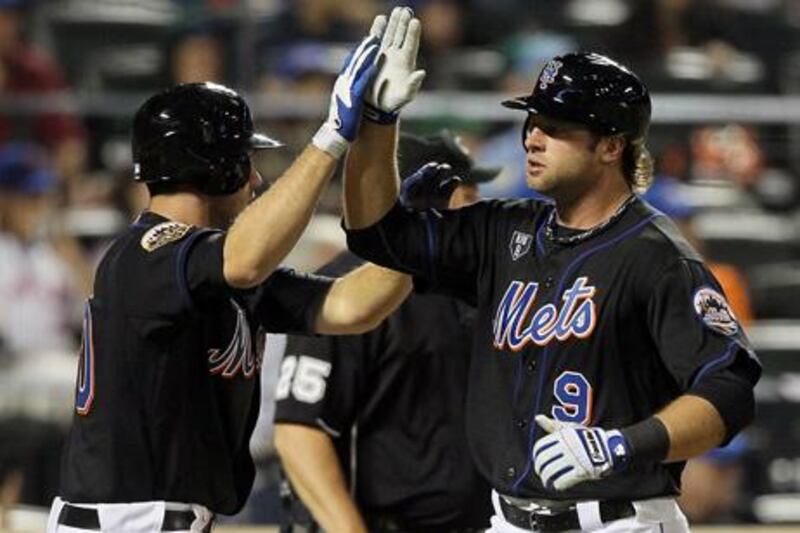 NEW YORK, NY - JUNE 03: Kirk Nieuwenhuis #9 and Josh Thole #30 of the New York Mets celebrate after scoring in the sixth inning against the St. Louis Cardinals at Citi Field on June 3, 2012 in the Flushing neighborhood of the Queens borough of New York City.   Jim McIsaac/Getty Images/AFP== FOR NEWSPAPERS, INTERNET, TELCOS & TELEVISION USE ONLY ==

