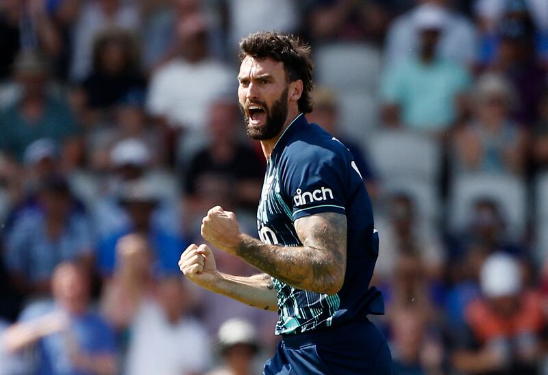 England's Reece Topley celebrates after taking the wicket of India opener Shikhar Dhawan for one. Reuters