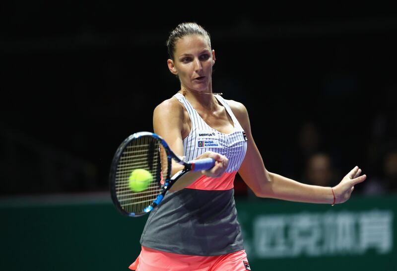 SINGAPORE - OCTOBER 24:  Karolina Pliskova of Czech Republic plays a forehand in her singles match against Garbine Muguruza of Spain during day 3 of the BNP Paribas WTA Finals Singapore presented by SC Global at Singapore Sports Hub on October 24, 2017 in Singapore.  (Photo by Clive Brunskill/Getty Images)