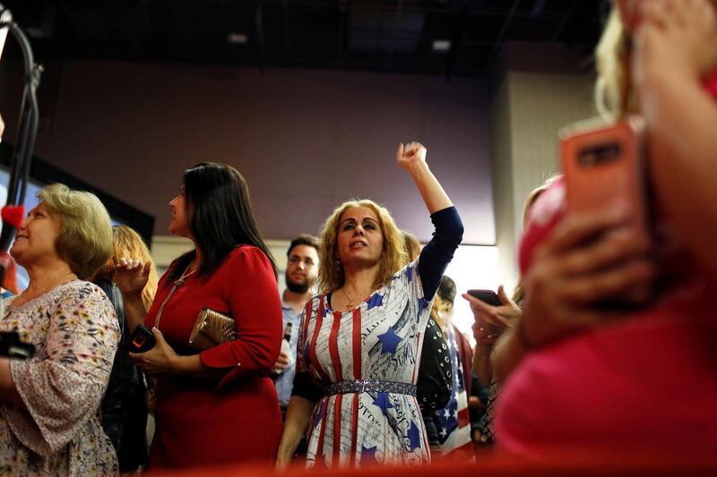 GOP supporters chant 'USA' as midterm elections results come in at the GOP watch party in Arizona. Reuters.