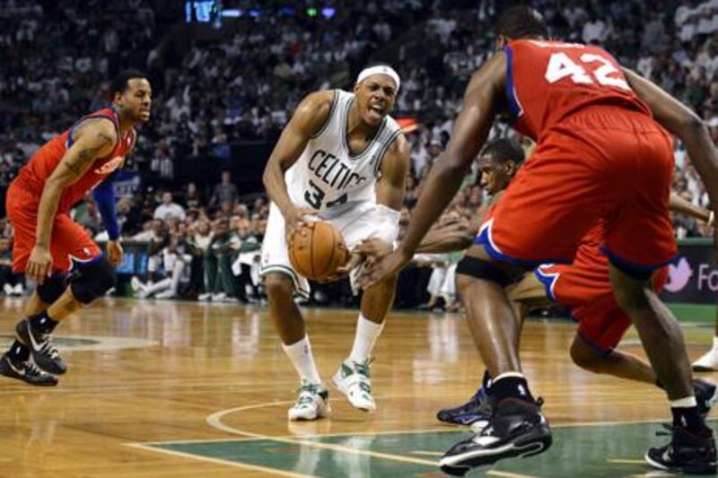 epa03237495 Boston Celtics forward Paul Pierce is fouled as he is surrounded by a trio of Philadelphia 76ers in the fourth quarter of the Eastern Conference Semifinal game seven at the TD Garden in Boston, Massachusetts, USA 26 May 2012. The best-of-seven series is tied 3-3 and the winner of game seven will go on to face the Miami Heat in the Eastern Conference Finals.  EPA/CJ GUNTHER CORBIS OUT