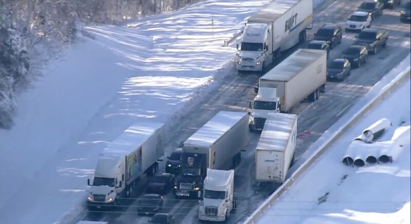 Hundreds of motorists were stranded all night in snow and freezing temperatures along a stretch of Interstate 95 after a crash involving six tractor-trailers in Virginia in January. WJLA / AP