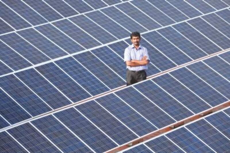 Provided photo of N. Yogesh, an Orb Energy, technician amidst solar panels on a roof in Bangalore.

 Adeel Halim/  Orb Energy 