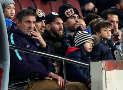 FC Barcelona's Lionel Messi, third left, Luis Suarez, second left, and Gerard Pique, center right, sit is the stands prior of a Spanish Copa del Rey soccer match between FC Barcelona and Cultural Leonesa at the Camp Nou stadium in Barcelona, Spain, Wednesday, Dec. 5, 2018. (AP Photo/Manu Fernandez)