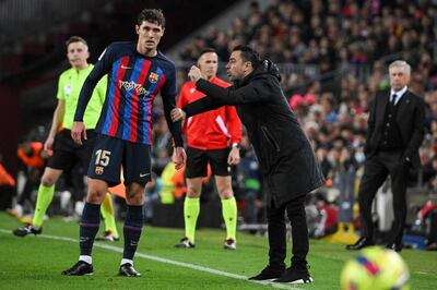 Barcelona coach Xavi talks to defender Andreas Christensen during the win over Barcelona. AFP