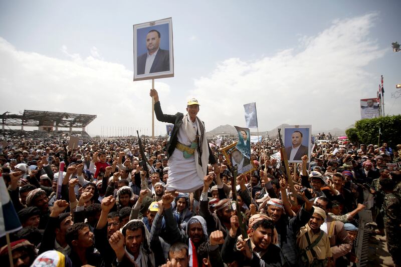 Houthi supporters hold posters of Saleh al-Samad, a senior Houthi official, during a funeral procession held for him and his six body guards, killed by Saudi-led air strikes last week, in Sanaa, Yemen April 28, 2018. REUTERS/Mohamed al-Sayaghi     TPX IMAGES OF THE DAY
