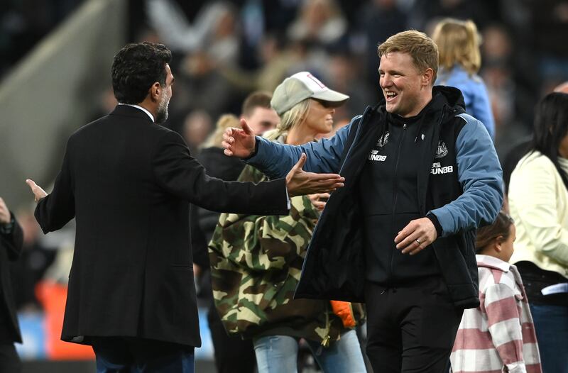 Newcastle head coach Eddie Howe celebrates with chairman Yasir Al Rumayyan after a 0-0 draw against Leicester City at St James Park on May 22, 2023, secured Champions League qualification. Getty Images