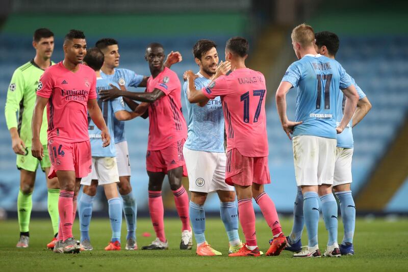 Manchester City and Real Madrid players at the final whistle. AP