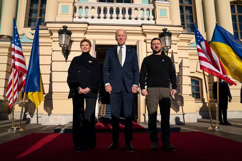 Mr Biden is flanked by Mr Zelenskyy and his wife Olena Zelenska. AP
