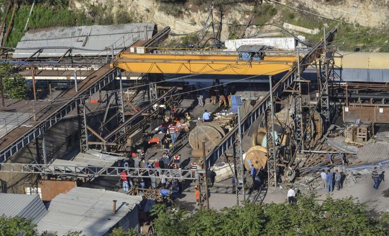 People gather at a mine in the Soma district in the western Turkish province of Manisa where an explosion left hundred of miners trapped on May 13, 2014. Ihlas News Agency / AFP