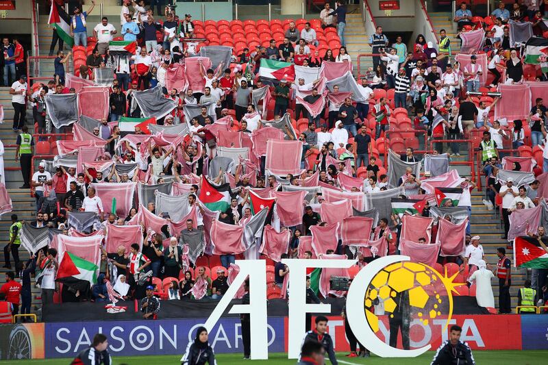 Fans attend the match between Palestine and Jordan. EPA