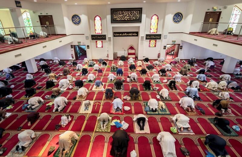 Worshippers observe social distancing at the Bradford Central Mosque on the first day of Eid, in Bradford, West Yorkshire, one of the areas where new measures have been implemented to prevent the spread of coronavirus. Stricter rules have been introduced for people in Greater Manchester, parts of East Lancashire, and West Yorkshire, banning members of different households from meeting each other indoors. (Photo by Danny Lawson/PA Images via Getty Images)